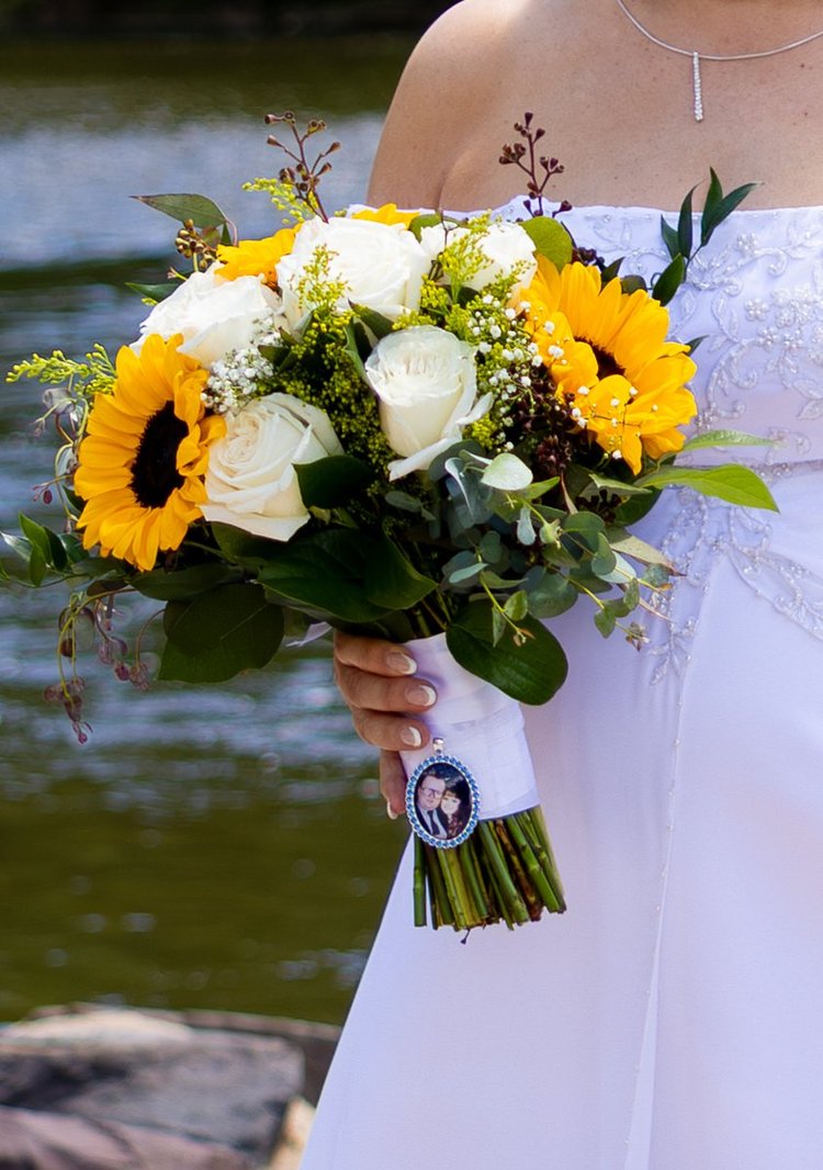 Wedding bride holding her bouquet by Domenic Graziano Flowers