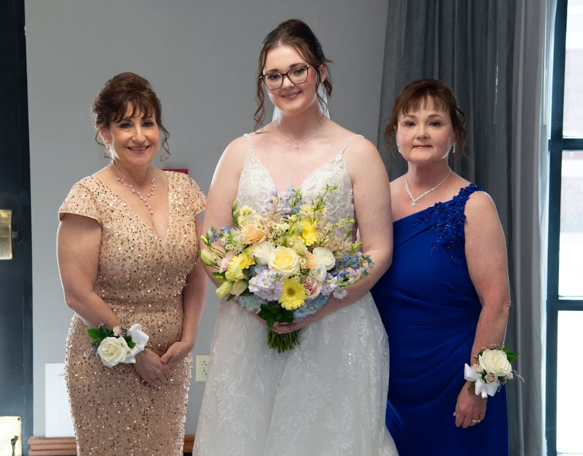Coughlin-DiMascio wedding bride with both mothers wearing their corsages by Domenic Graziano Flowers