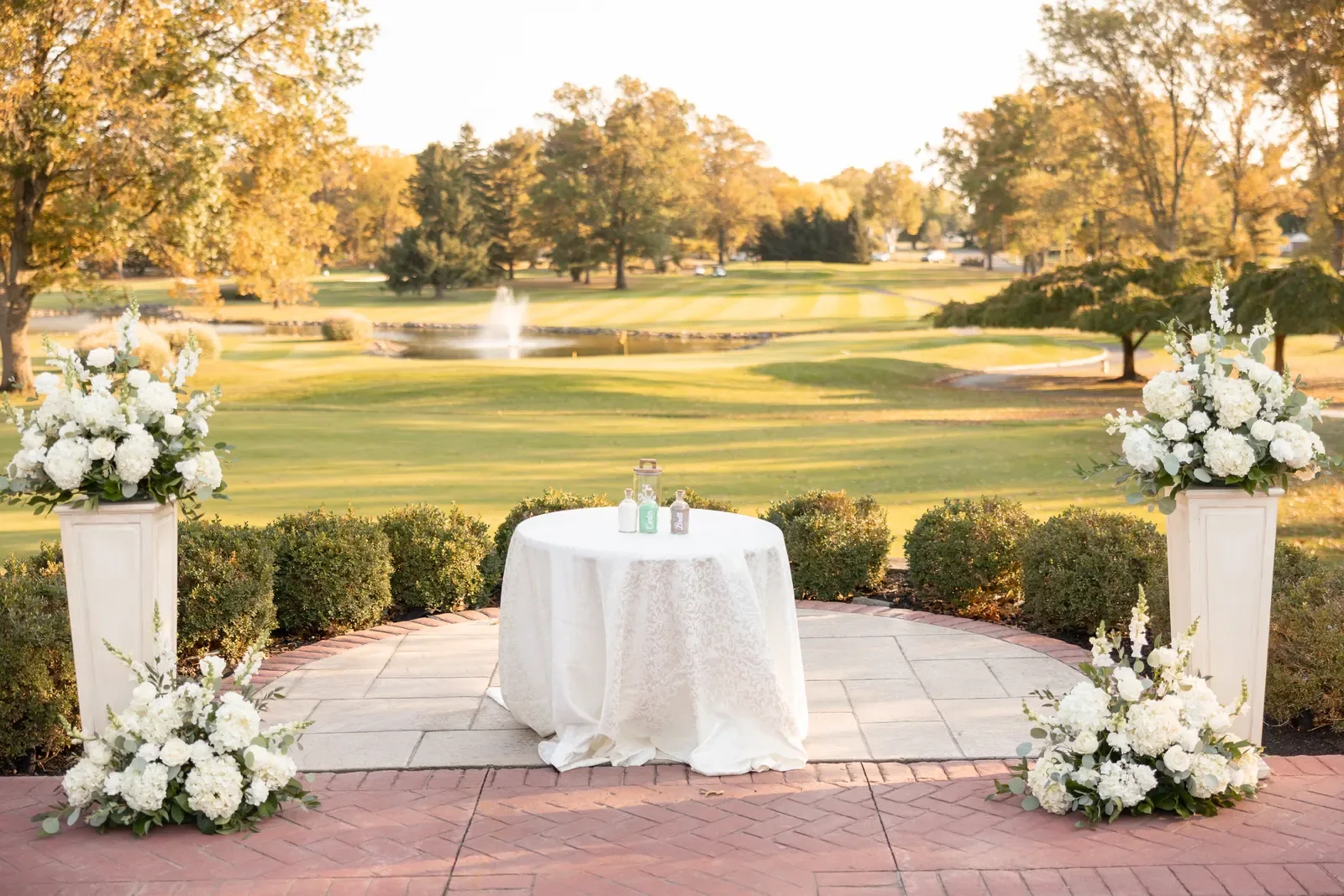 Osborn wedding ceremony pedestal arrangements at Northampton Valley Country Club by Domenic Graziano Flowers